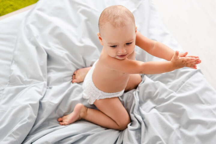 Diaper Brand Names: A cute baby wearing a diaper