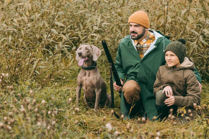 Hunting Business Names: a man with hunting dog and gun